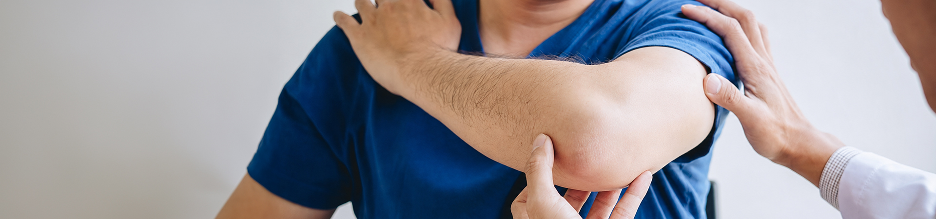 A patient being assisted with their arm injury.